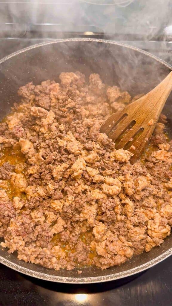 cooked ground beef and sausage meat in a skillet