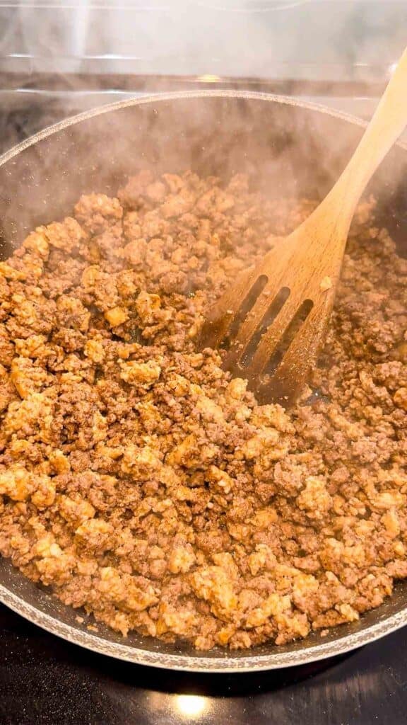 seasoned ground meat mixture in a skillet