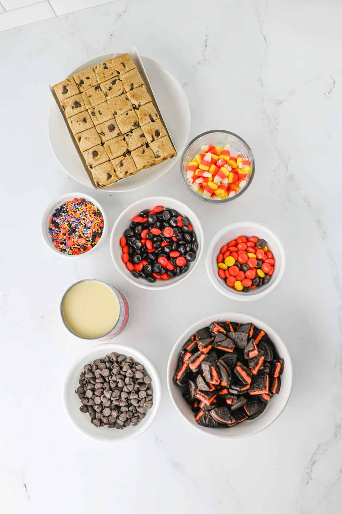 halloween 7 layer bars ingredients on the kitchen counter