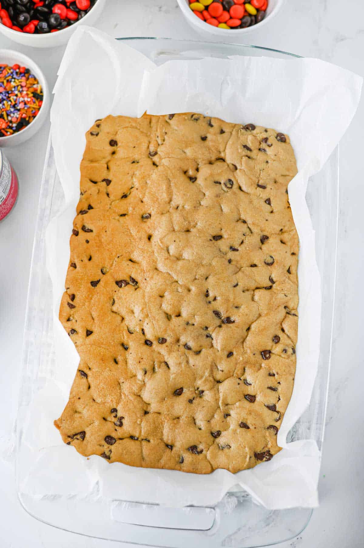 cookie dough in a baking dish after paritally baking