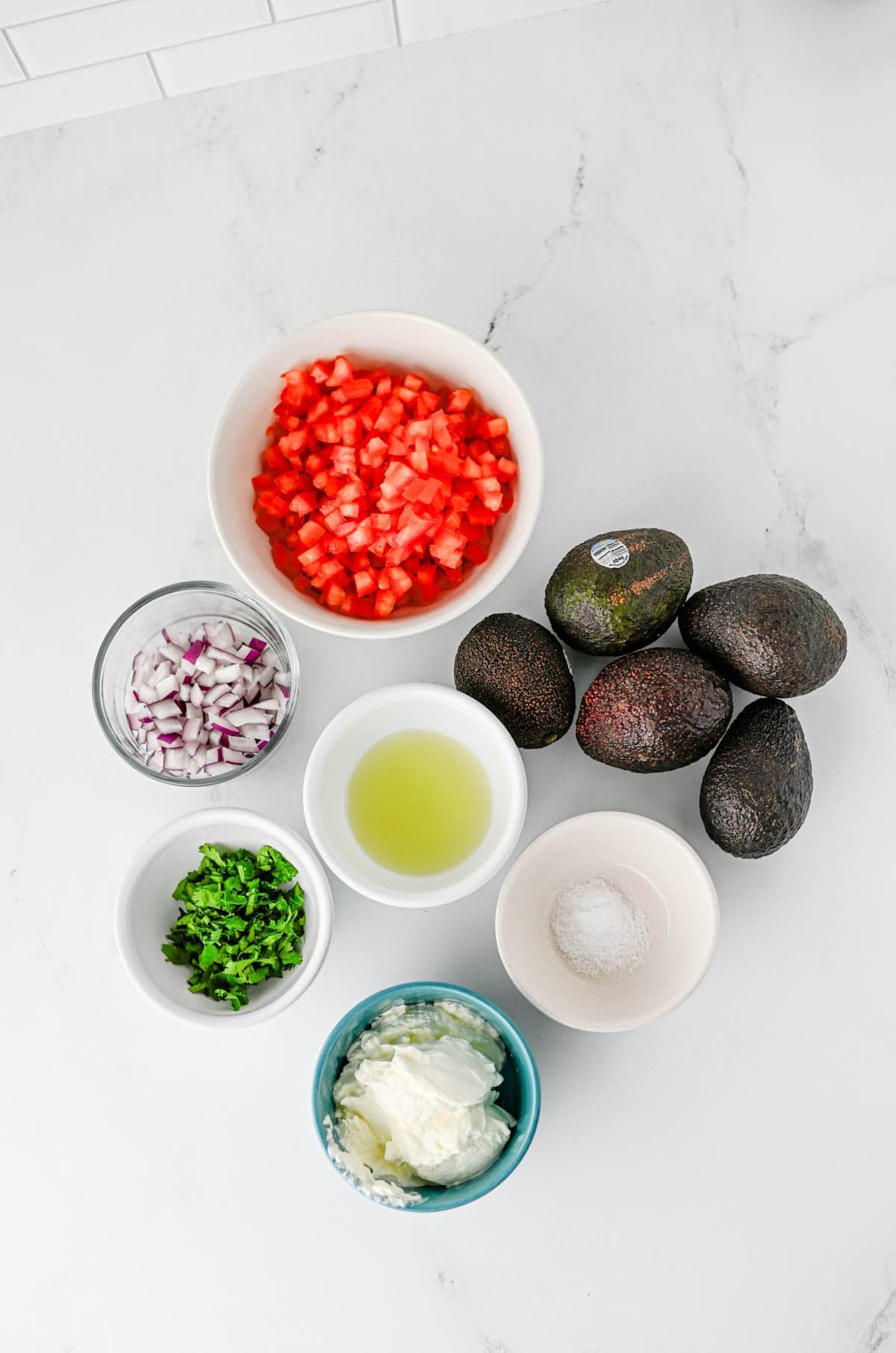 halloween guacamole ingredients on the kitchen counter