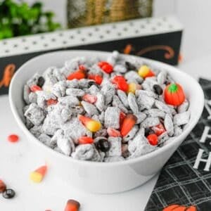 Halloween Muddy Buddies are easy Halloween snack for parties and spooky season snacking! This Halloween Muddy Buddies Recipe combines crunchy Rice Chex cereal with melted chocolate, creamy peanut butter, butter, and powdered sugar for classic Puppy Chow, then adds Halloween M&Ms and candy corn for a festive twist. If you need Easy Halloween Treats, Halloween Party Food, Halloween Snacks For Kids, or a No Bake Halloween Dessert, this sweet and crunchy snack mix takes just 15 minutes of prep. Serve it at a Halloween Party, Halloween Sleepover, classroom celebration, fall gathering, or Halloween movie night. This Halloween Chex Mix is colorful, crowd-pleasing, and perfect for anyone searching for Halloween Puppy Chow, Muddy Buddies Chex Mix, Halloween Snack Mix, or fun Halloween Food Ideas.