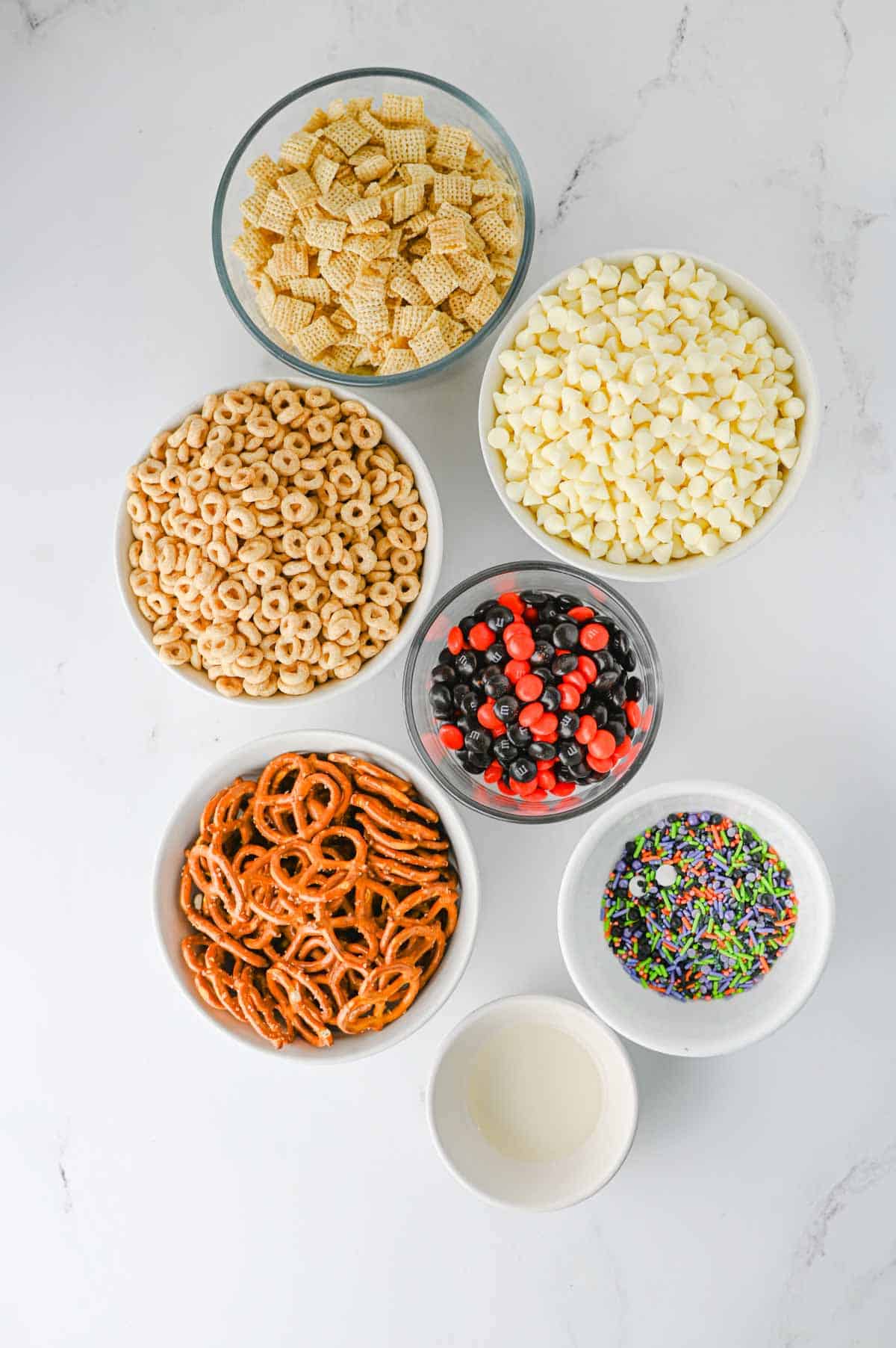 halloween snack mix ingredients on the kitchen counter