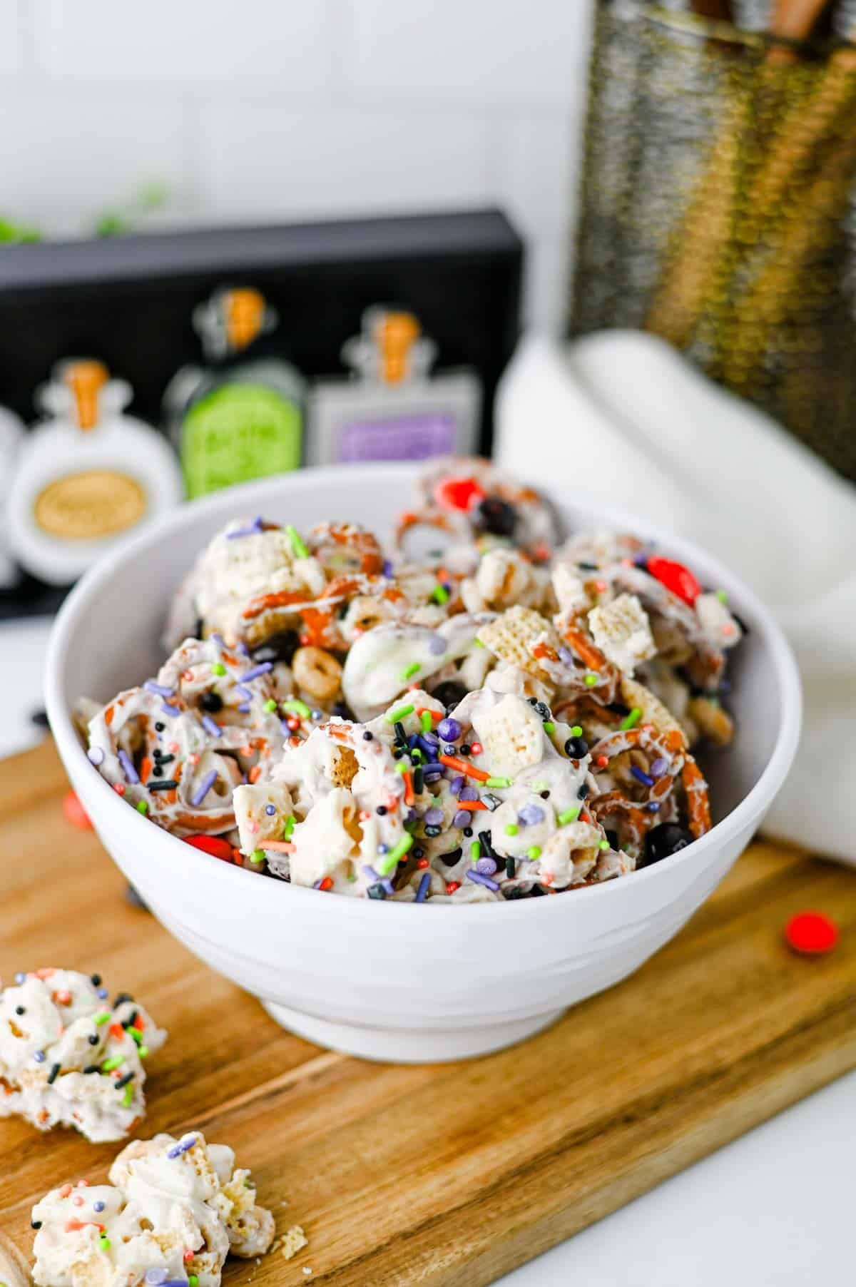 This easy Halloween Snack Mix is the ultimate sweet and salty treat for the spooky season! Made with Rice Chex cereal, Honey Nut Cheerios, pretzels, white chocolate, Halloween M&Ms, and colorful sprinkles, it's perfect for parties, movie nights, and trick-or-treating. If you need Halloween Snack Ideas, Halloween Party Food, Easy No Bake Halloween Treats, Fun Halloween Food, Halloween Treats For Kids, Halloween Chex Mix, or simple Halloween Desserts, this crunchy snack mix is a must-try. It takes just 15 minutes to prep, requires no baking, and is easy to make ahead. The sweet and salty combination makes every bite irresistible. Save this festive Halloween Party Snack Mix for a colorful, crowd-pleasing Halloween snack that kids and adults will keep grabbing by the handful!