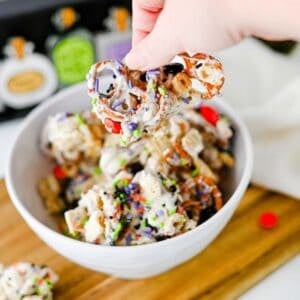 This easy Halloween Snack Mix is the ultimate sweet and salty treat for the spooky season! Made with Rice Chex cereal, Honey Nut Cheerios, pretzels, white chocolate, Halloween M&Ms, and colorful sprinkles, it's perfect for parties, movie nights, and trick-or-treating. If you need Halloween Snack Ideas, Halloween Party Food, Easy No Bake Halloween Treats, Fun Halloween Food, Halloween Treats For Kids, Halloween Chex Mix, or simple Halloween Desserts, this crunchy snack mix is a must-try. It takes just 15 minutes to prep, requires no baking, and is easy to make ahead. The sweet and salty combination makes every bite irresistible. Save this festive Halloween Party Snack Mix for a colorful, crowd-pleasing Halloween snack that kids and adults will keep grabbing by the handful!