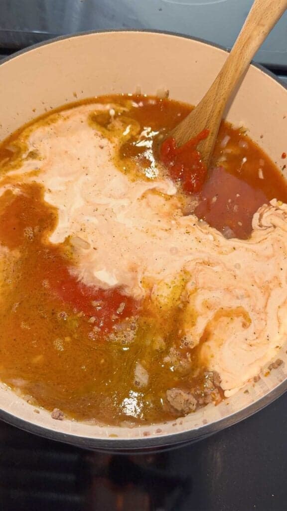 chicken broth, heavy cream and pasta sauce added to a large pot