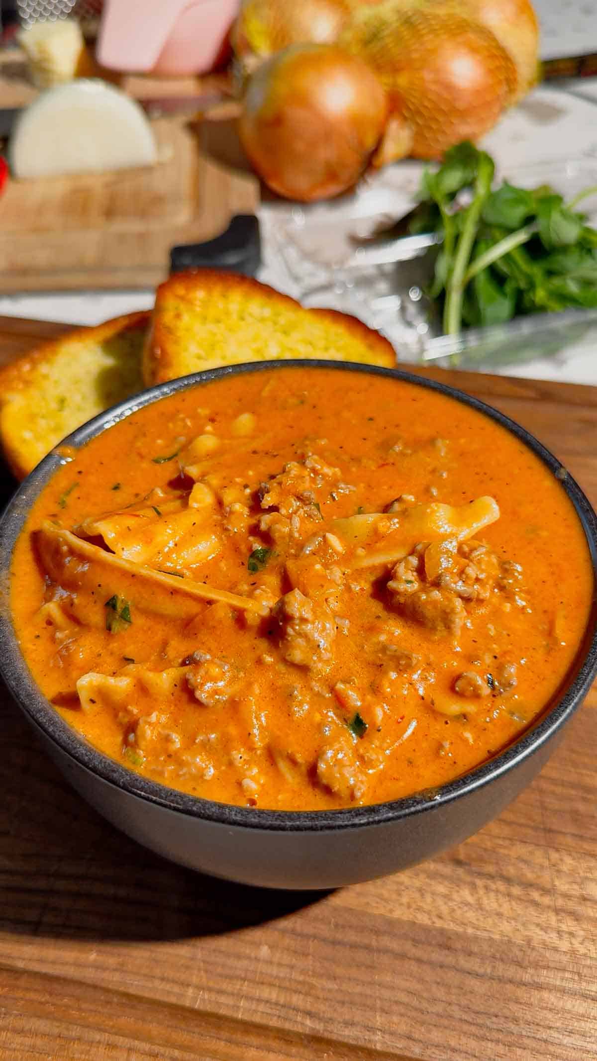 This easy Lasagna Soup recipe is the ultimate cozy comfort food for busy weeknights! Made with Italian sausage, ground beef, broken lasagna noodles, pasta sauce, chicken broth, heavy cream, mozzarella, ricotta, Parmesan, and fresh basil, this hearty soup has all the flavors of classic lasagna without the work of layering and baking. If you love easy soup recipes, one pot dinners, Italian soup recipes, or comforting family dinner ideas, this creamy Lasagna Soup is a must-try. It’s an easy 35 minute meal that’s perfect for fall dinners, cold winter nights, or anytime you’re craving cheesy pasta. Save this One Pot Lasagna Soup for an easy weeknight dinner, cozy Sunday supper, or simple family meal everyone will love. The creamy ricotta topping makes every bowl extra delicious!