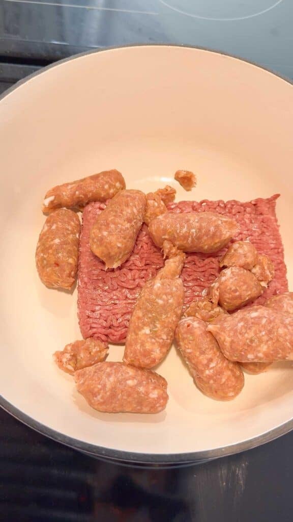 raw italian sausage and ground beef in a large pot