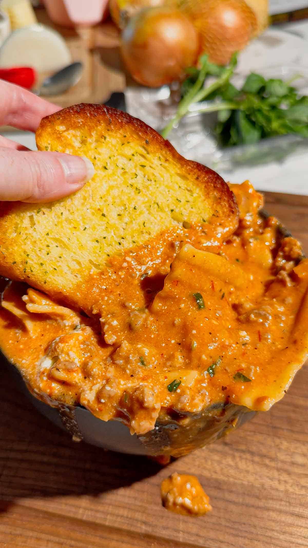 This easy Lasagna Soup recipe is the ultimate cozy comfort food for busy weeknights! Made with Italian sausage, ground beef, broken lasagna noodles, pasta sauce, chicken broth, heavy cream, mozzarella, ricotta, Parmesan, and fresh basil, this hearty soup has all the flavors of classic lasagna without the work of layering and baking. If you love easy soup recipes, one pot dinners, Italian soup recipes, or comforting family dinner ideas, this creamy Lasagna Soup is a must-try. It’s an easy 35 minute meal that’s perfect for fall dinners, cold winter nights, or anytime you’re craving cheesy pasta. Save this One Pot Lasagna Soup for an easy weeknight dinner, cozy Sunday supper, or simple family meal everyone will love. The creamy ricotta topping makes every bowl extra delicious!