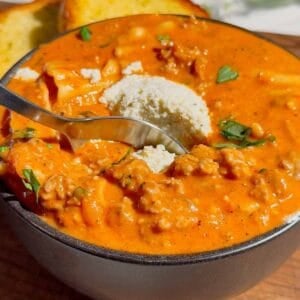 This easy Lasagna Soup recipe is the ultimate cozy comfort food for busy weeknights! Made with Italian sausage, ground beef, broken lasagna noodles, pasta sauce, chicken broth, heavy cream, mozzarella, ricotta, Parmesan, and fresh basil, this hearty soup has all the flavors of classic lasagna without the work of layering and baking. If you love easy soup recipes, one pot dinners, Italian soup recipes, or comforting family dinner ideas, this creamy Lasagna Soup is a must-try. It’s an easy 35 minute meal that’s perfect for fall dinners, cold winter nights, or anytime you’re craving cheesy pasta. Save this One Pot Lasagna Soup for an easy weeknight dinner, cozy Sunday supper, or simple family meal everyone will love. The creamy ricotta topping makes every bowl extra delicious!