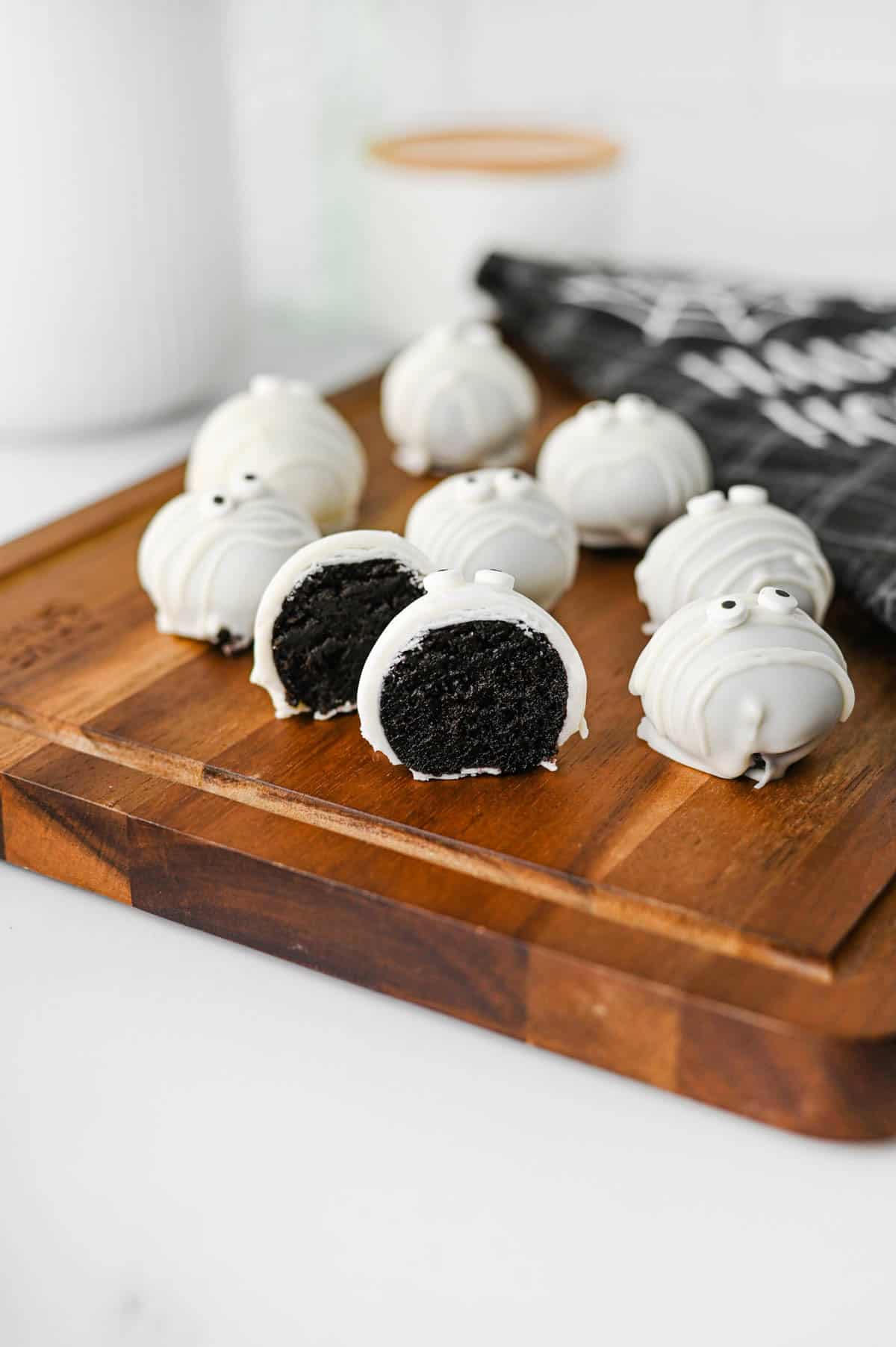 These Mummy Oreo Balls are the ultimate spooky treat for Halloween parties, dessert tables, and school celebrations! Made with crushed Oreo cookies, cream cheese, vanilla almond bark, and candy eyes, this easy Mummy Oreo Balls Recipe is a fun No Bake Halloween Treat that everyone will love. If you're searching for Halloween Oreo Desserts, Mummy Oreo Truffles, Halloween Oreo Balls, Easy Halloween Treats For Kids, or Halloween Dessert Ideas Easy enough for busy days, these cute bites are perfect. The white chocolate mummy wrapping and silly candy eyes make them an adorable Halloween Party Food idea. Add these Oreo Mummy Balls to your list of Halloween Desserts No Bake, Spooky Treats, Halloween Goodies, and Easy Halloween Desserts For Parties for a sweet treat everyone will grab!