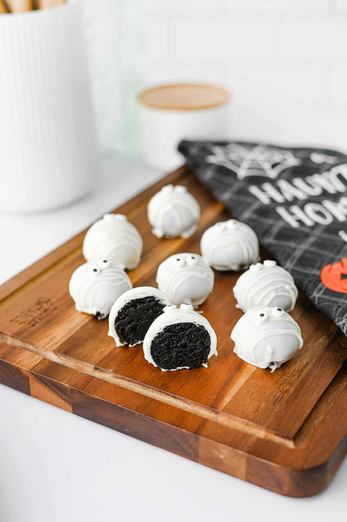 These Mummy Oreo Balls are the ultimate spooky treat for Halloween parties, dessert tables, and school celebrations! Made with crushed Oreo cookies, cream cheese, vanilla almond bark, and candy eyes, this easy Mummy Oreo Balls Recipe is a fun No Bake Halloween Treat that everyone will love. If you're searching for Halloween Oreo Desserts, Mummy Oreo Truffles, Halloween Oreo Balls, Easy Halloween Treats For Kids, or Halloween Dessert Ideas Easy enough for busy days, these cute bites are perfect. The white chocolate mummy wrapping and silly candy eyes make them an adorable Halloween Party Food idea. Add these Oreo Mummy Balls to your list of Halloween Desserts No Bake, Spooky Treats, Halloween Goodies, and Easy Halloween Desserts For Parties for a sweet treat everyone will grab!