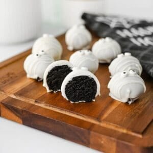 These Mummy Oreo Balls are the ultimate spooky treat for Halloween parties, dessert tables, and school celebrations! Made with crushed Oreo cookies, cream cheese, vanilla almond bark, and candy eyes, this easy Mummy Oreo Balls Recipe is a fun No Bake Halloween Treat that everyone will love. If you're searching for Halloween Oreo Desserts, Mummy Oreo Truffles, Halloween Oreo Balls, Easy Halloween Treats For Kids, or Halloween Dessert Ideas Easy enough for busy days, these cute bites are perfect. The white chocolate mummy wrapping and silly candy eyes make them an adorable Halloween Party Food idea. Add these Oreo Mummy Balls to your list of Halloween Desserts No Bake, Spooky Treats, Halloween Goodies, and Easy Halloween Desserts For Parties for a sweet treat everyone will grab!