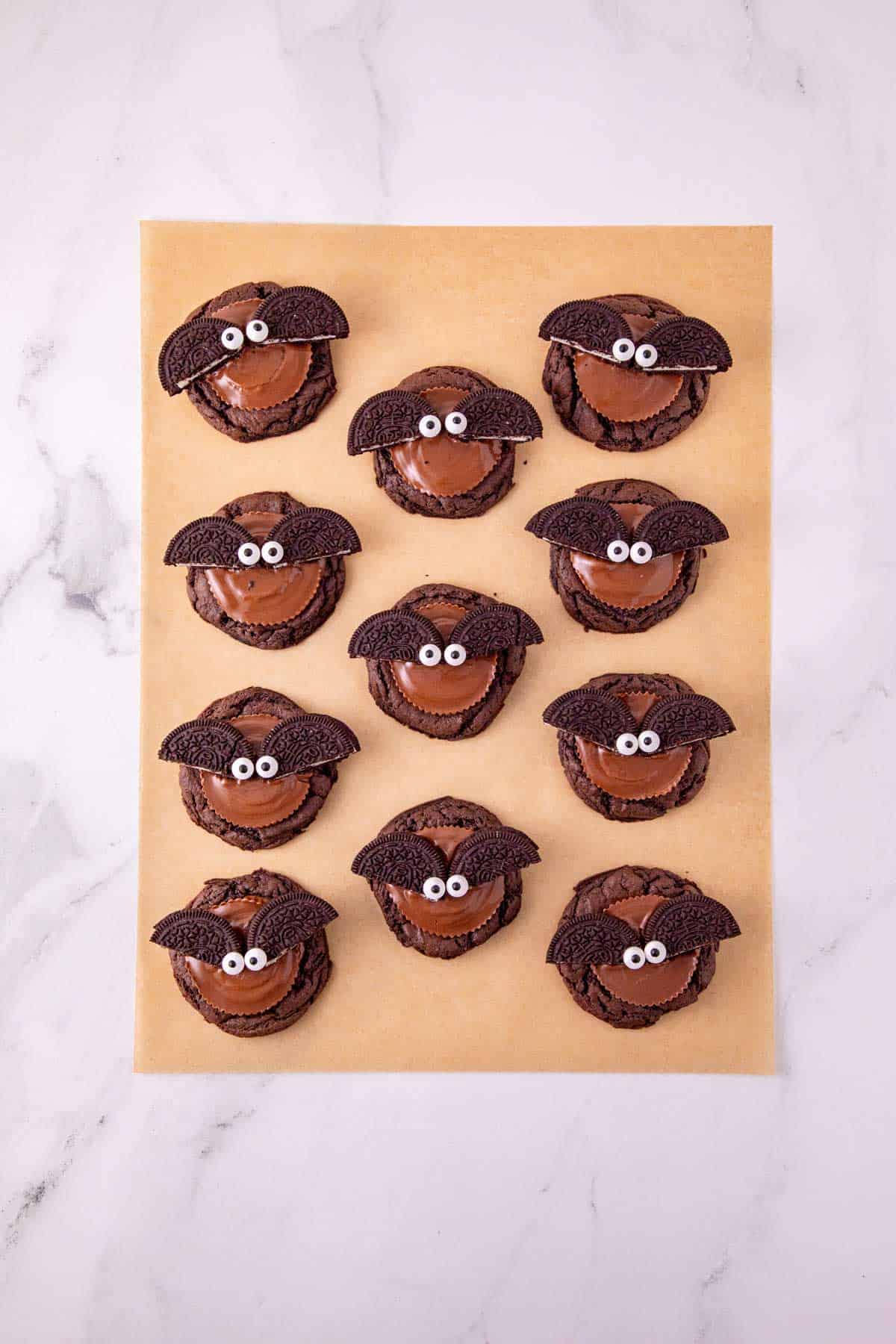 oreo bat cookies on parchment paper