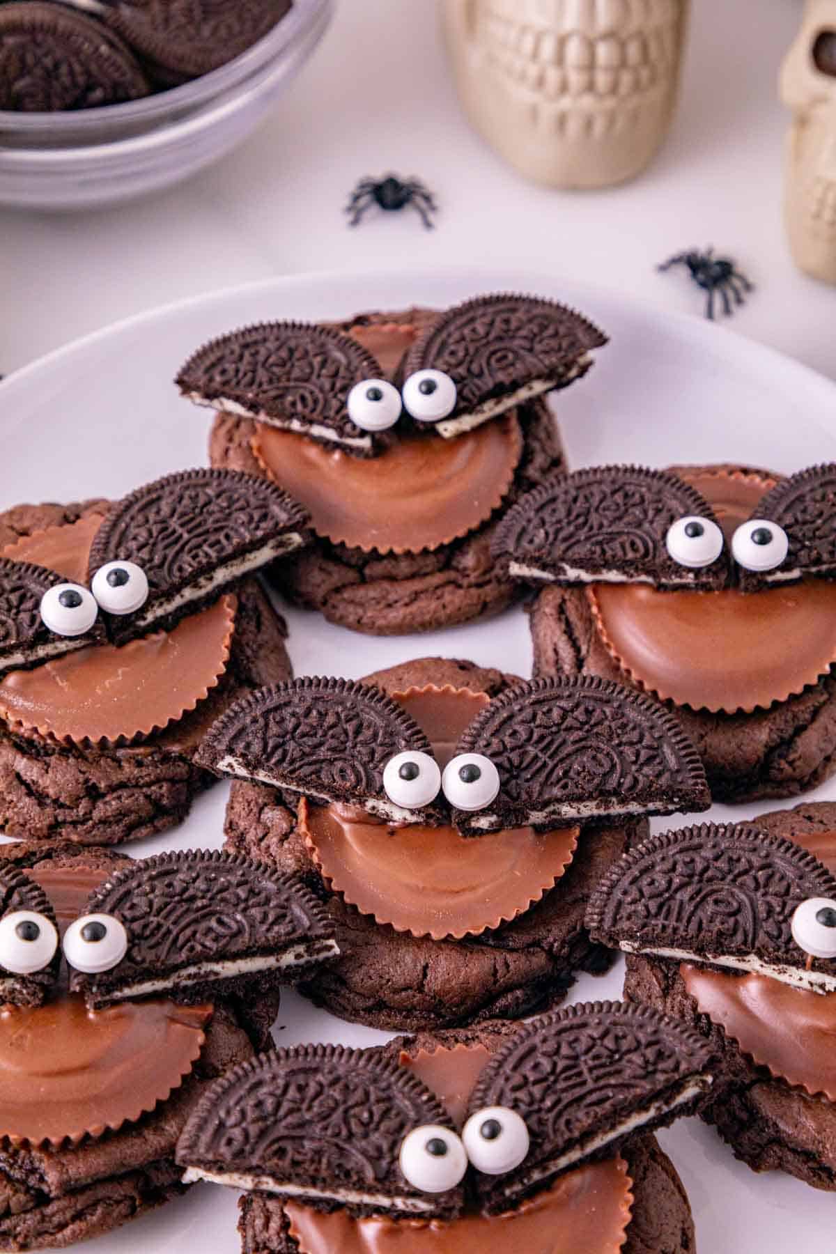 oreo bats with candy eyes on top of chocolate cookies