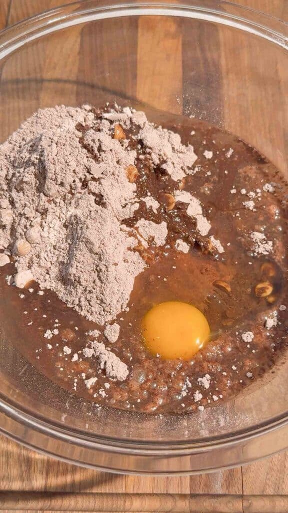 egg, oil and brownie mix in a mixing bowl
