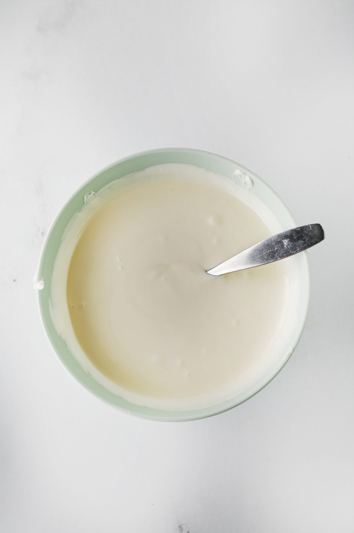 melted white almond bark in a bowl