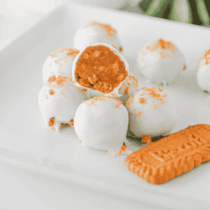 These Biscoff Truffles are an easy no bake dessert made with Biscoff cookie crumbs, cream cheese, cookie butter and almond bark for a rich, creamy bite-sized treat. Perfect for Christmas dessert trays, holiday parties, cookie exchanges, homemade gifts, potlucks and sweet snack boards, these cookie butter truffles are simple to make with just a few ingredients. If you love Biscoff recipes, Lotus Biscoff desserts, no bake truffles, easy candy recipes and cream cheese truffles, this sweet treat is a must try. The crunchy cookie crumb topping makes them look pretty enough for gifting, while the smooth cookie butter filling makes them dangerously good for any dessert table.