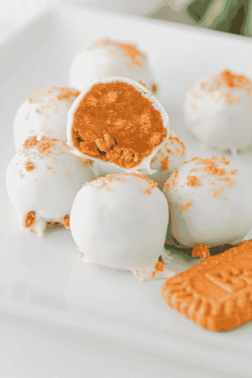 These Biscoff Truffles are an easy no bake dessert made with Biscoff cookie crumbs, cream cheese, cookie butter and almond bark for a rich, creamy bite-sized treat. Perfect for Christmas dessert trays, holiday parties, cookie exchanges, homemade gifts, potlucks and sweet snack boards, these cookie butter truffles are simple to make with just a few ingredients. If you love Biscoff recipes, Lotus Biscoff desserts, no bake truffles, easy candy recipes and cream cheese truffles, this sweet treat is a must try. The crunchy cookie crumb topping makes them look pretty enough for gifting, while the smooth cookie butter filling makes them dangerously good for any dessert table.