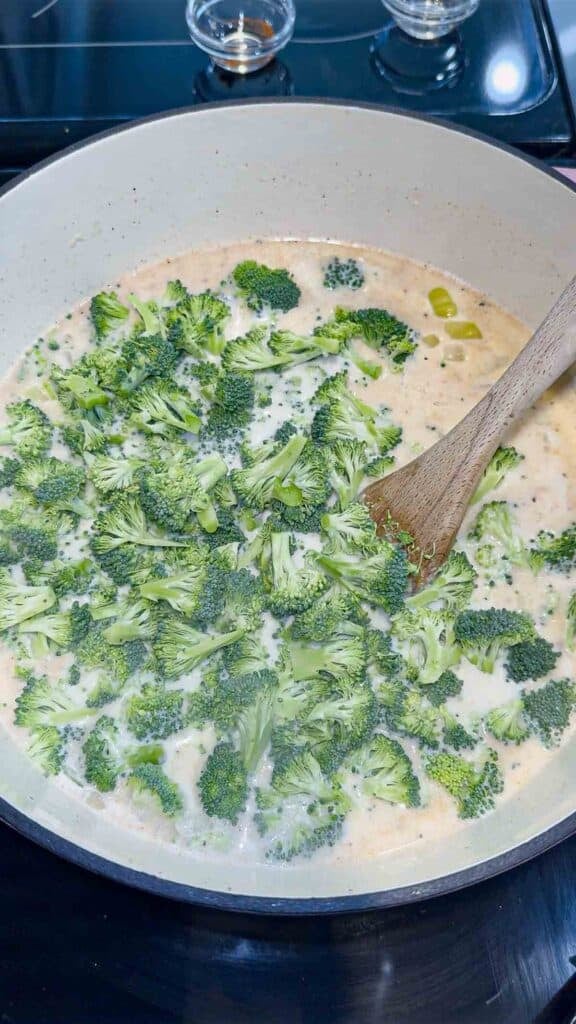 broccoli florets added to soup