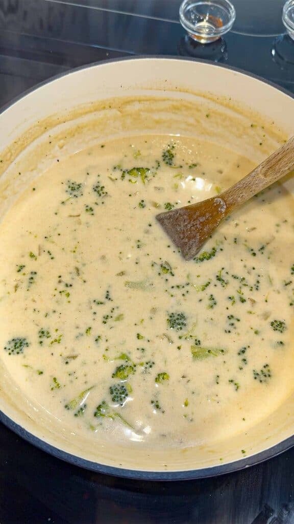 stirring creamy broccoli soup