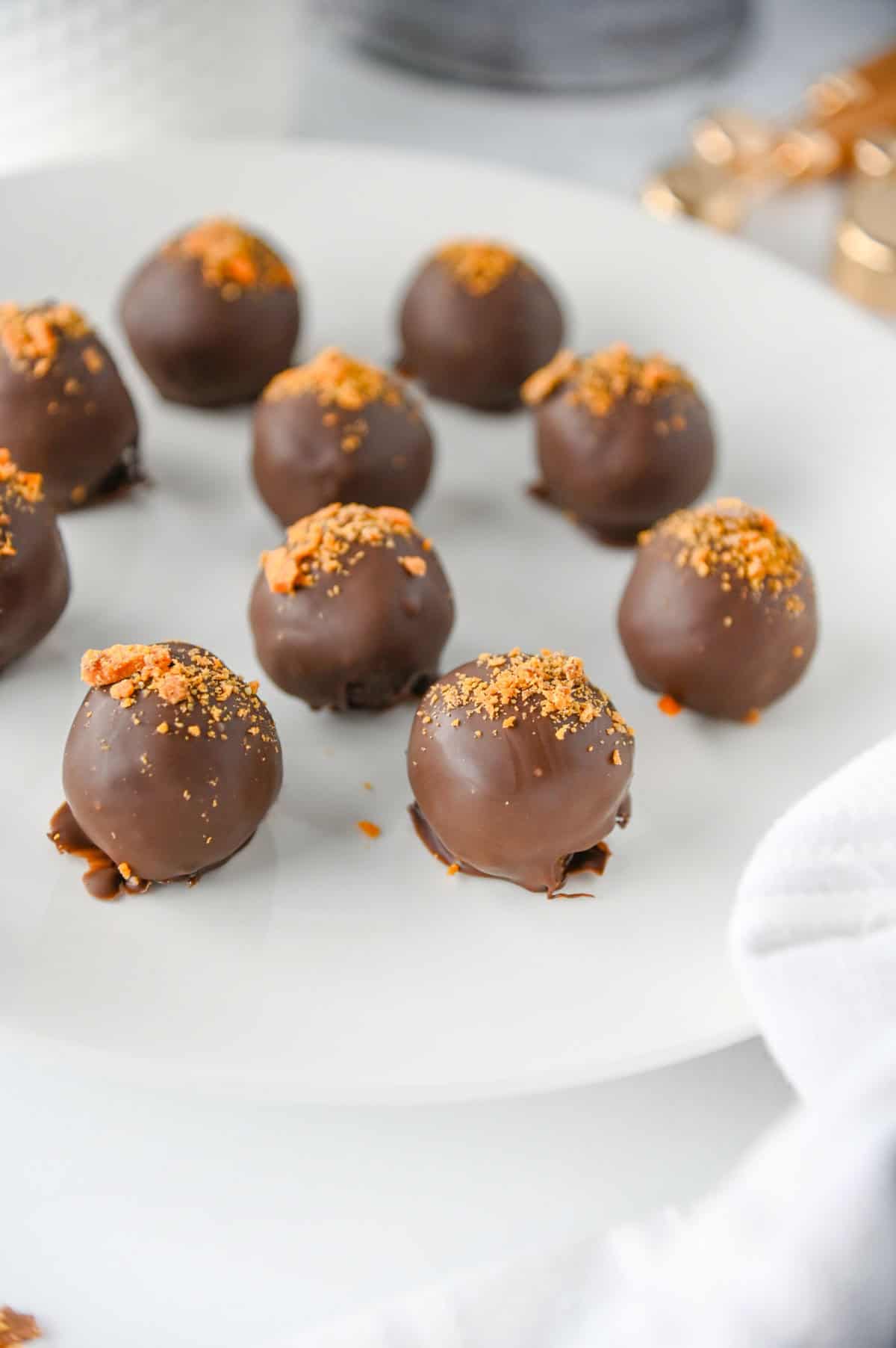 finished butterfinger balls on a plate