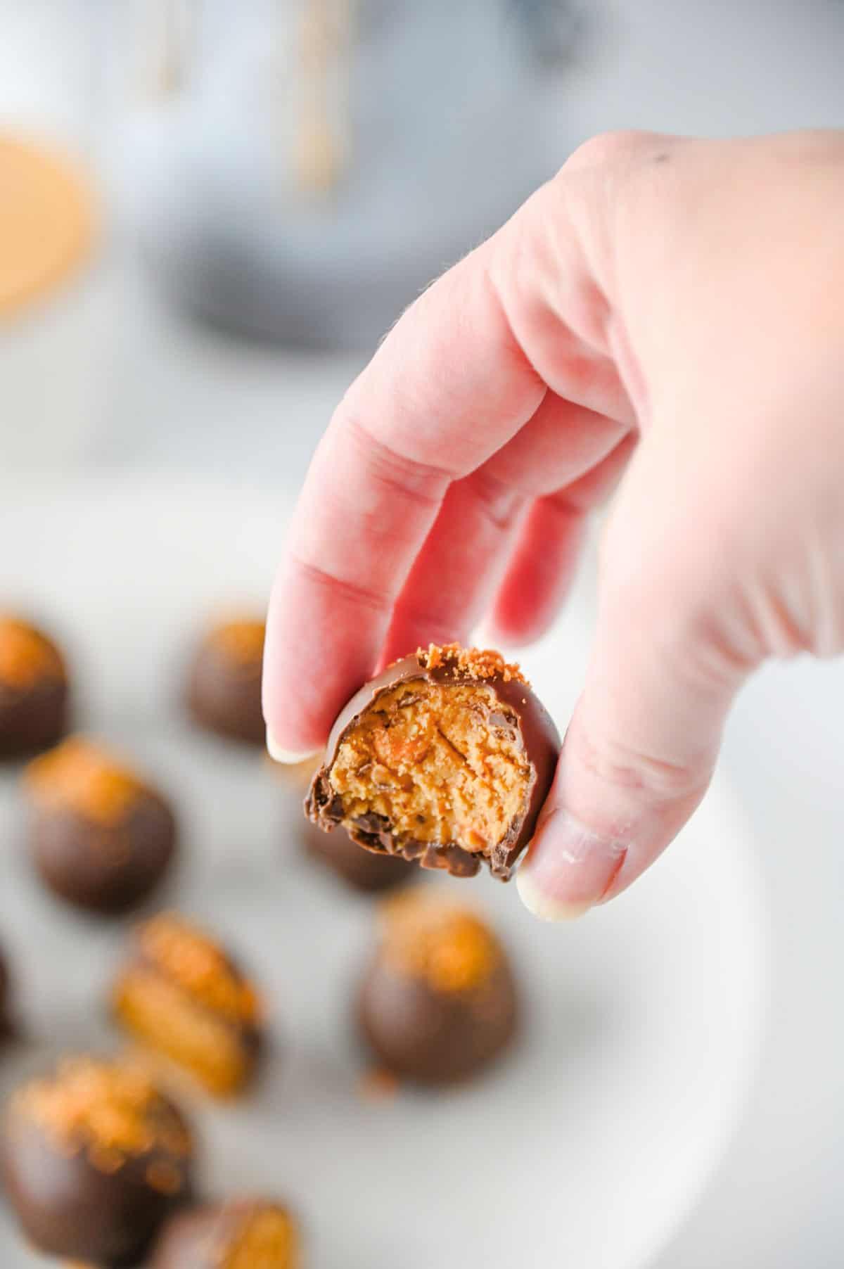 hand holding a butterfinger ball