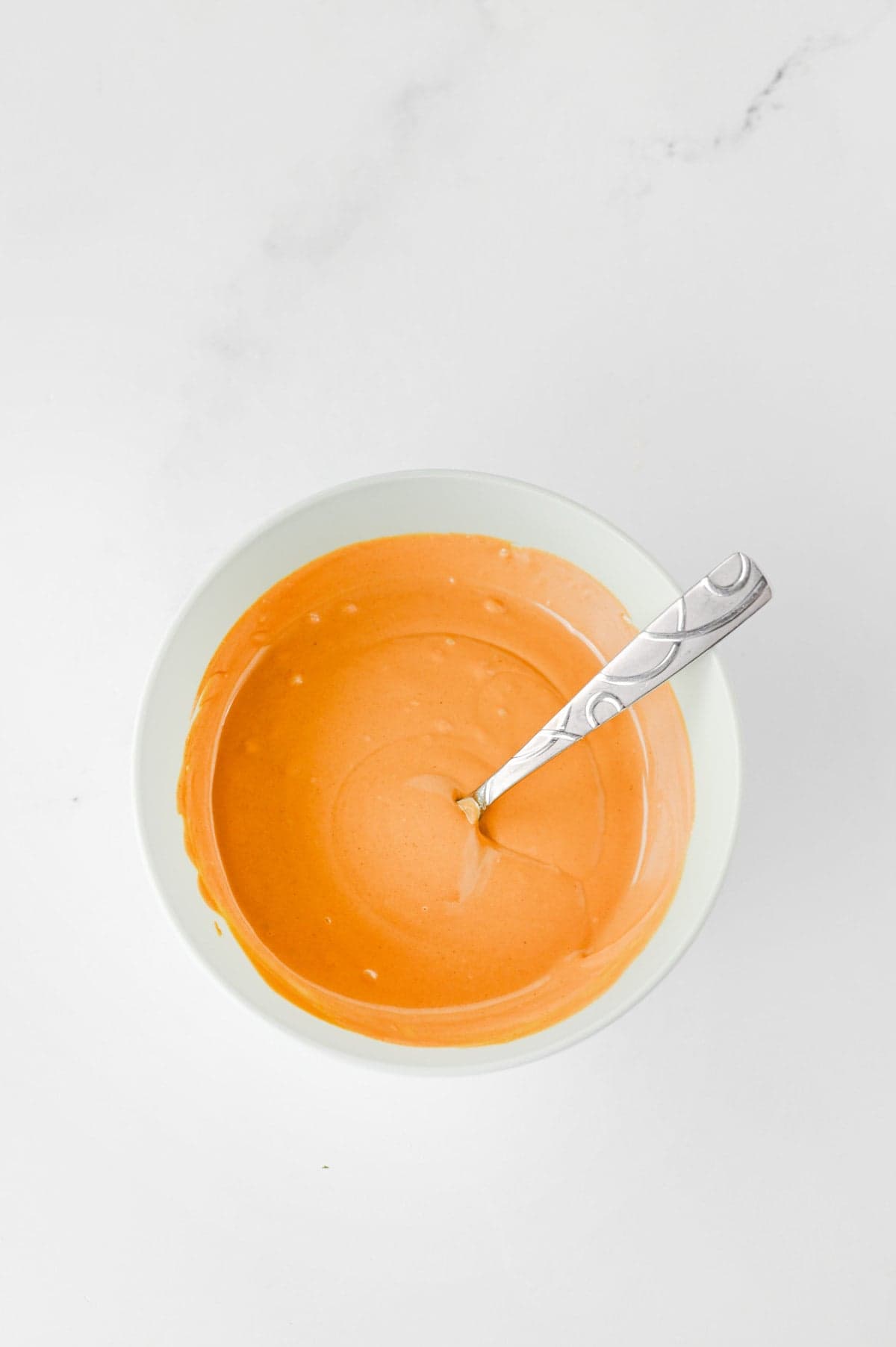 melted peanut butter and butterscotch baking chips mixture in a mixing bowl