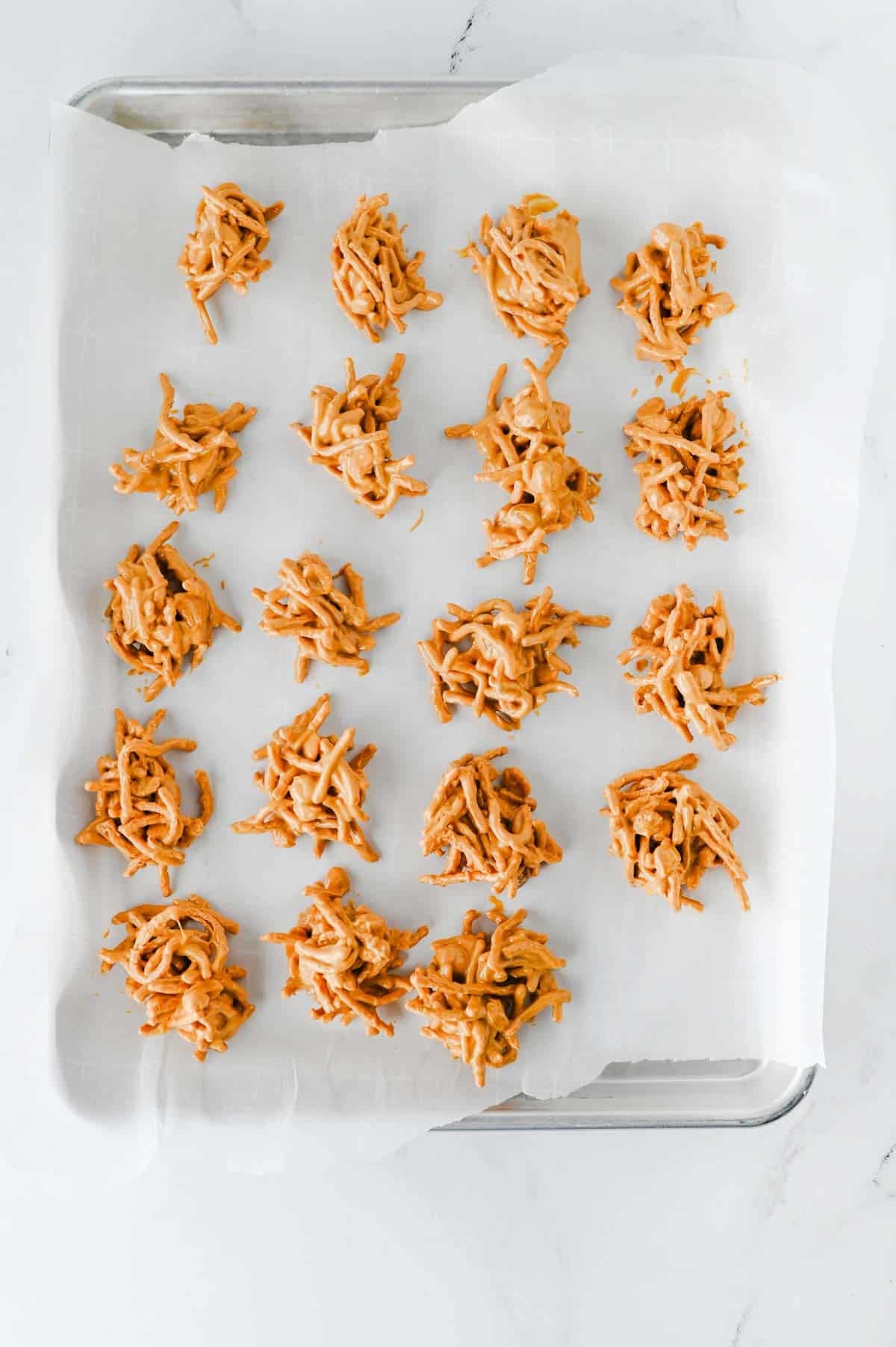 butterscotch haystacks on a parchment lined baking sheet