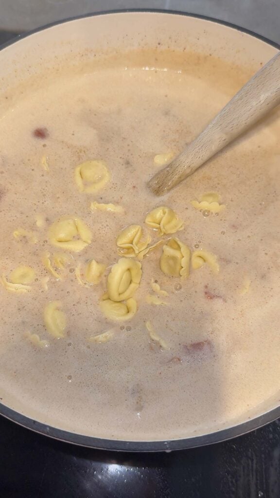 tortellini added to pot with creamy hamburger soup