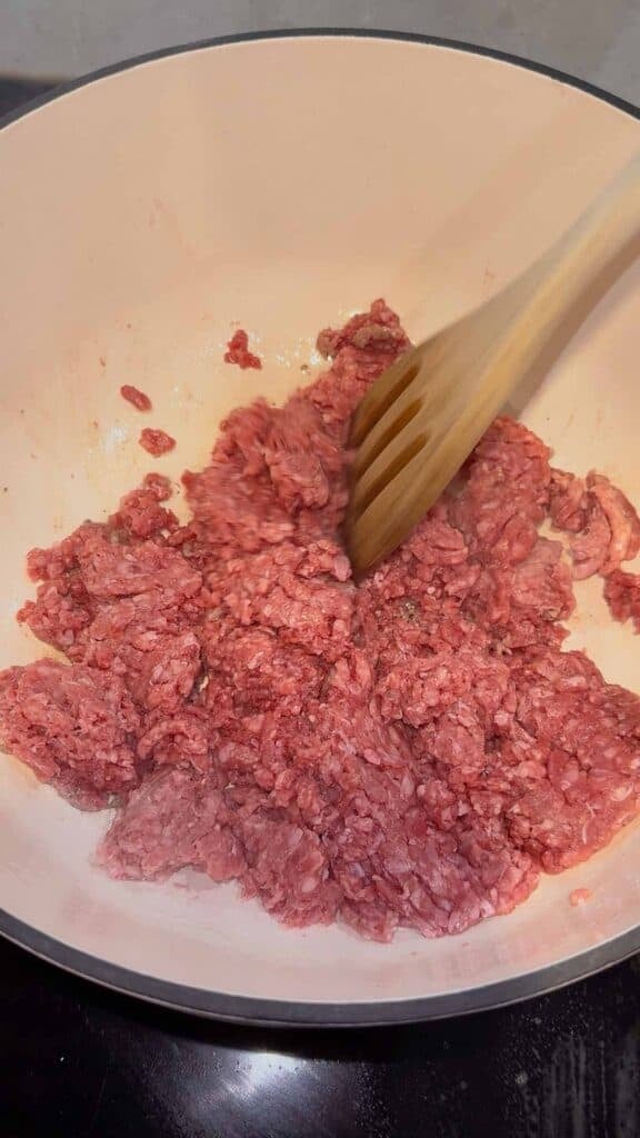raw ground beef in a dutch oven