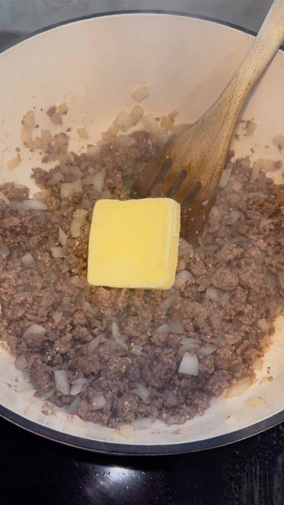 butter added to pot with cooked ground beef