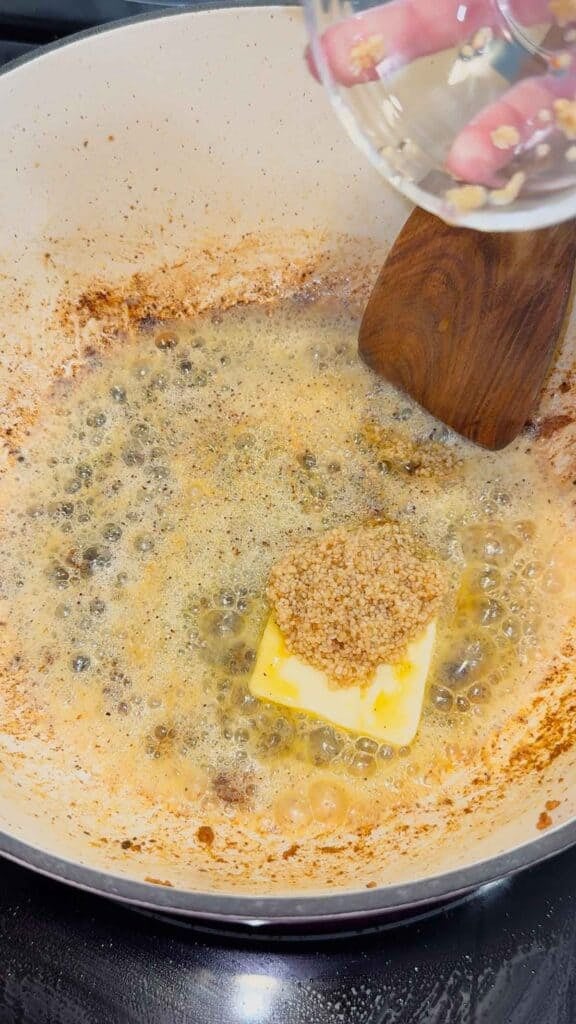 chopped garlic added to pot with melted butter
