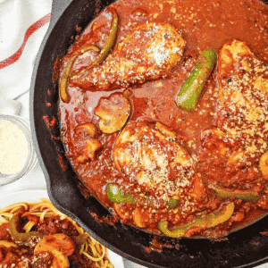This easy Chicken Cacciatore recipe is a hearty Italian inspired dinner made with chicken breasts, mushrooms and green peppers simmered in a rich tomato sauce with garlic, Italian seasoning and Parmesan cheese. Ready in just 50 minutes, this skillet chicken dinner is perfect for busy weeknights and family meals. Serve this chicken breast recipe over pasta, noodles or rice to soak up every bite of the delicious sauce. If you love easy chicken recipes, comforting Italian chicken dinners and simple family dinner ideas, save this homemade chicken cacciatore for your next meal plan. With simple ingredients and plenty of flavour, this chicken and tomato sauce recipe is an easy way to bring comfort food to the dinner table. Save this recipe for dinner!