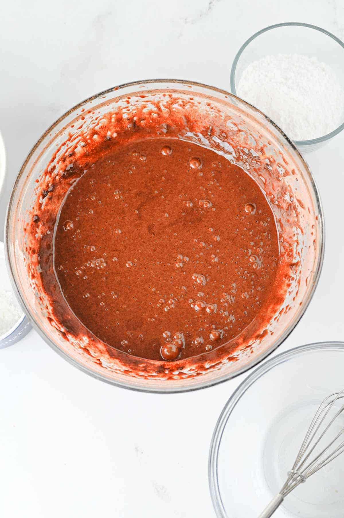 batter for chocolate crinkle cookies in a glass bowl