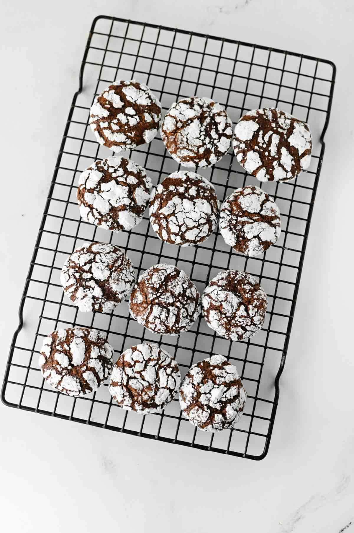 chocolate crinkle cookies on a cooling rack