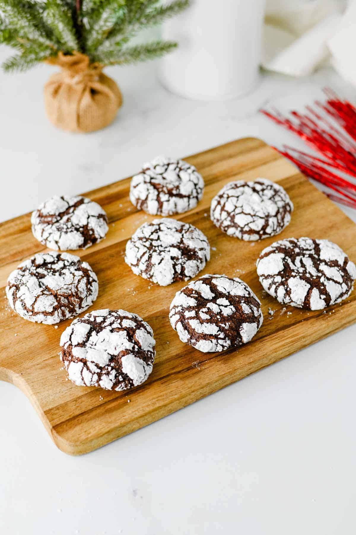 chocolate crinkle cookies on a wooden board
