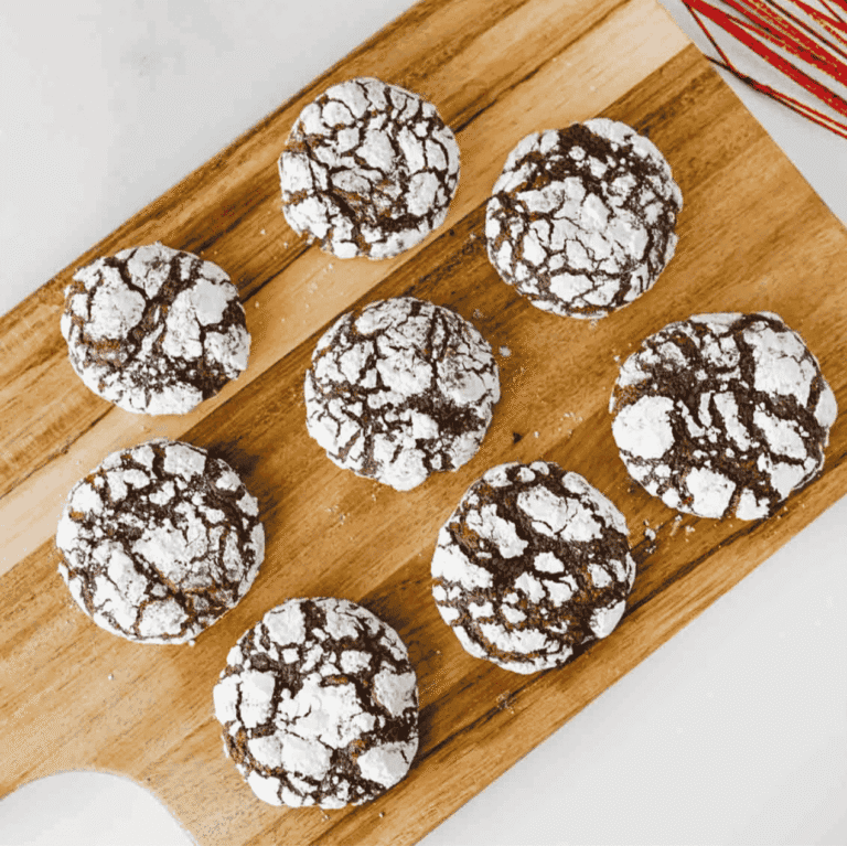 These Chocolate Crinkle Cookies are rich, fudgy, and rolled in powdered sugar for that classic crackled holiday cookie look. Made with cocoa powder, granulated sugar, oil, eggs, vanilla, flour, baking powder, salt, and powdered sugar, this easy chocolate cookie recipe chills overnight so the dough bakes up soft, chewy, and deeply chocolatey. Perfect for Christmas cookie trays, holiday baking, cookie exchanges, dessert platters, bake sales, homemade food gifts, or cozy weekend treats, these homemade chocolate crinkles are simple to make and always look bakery-worthy. Save this recipe for easy Christmas cookies, fudgy chocolate cookies, powdered sugar cookies, make ahead cookie dough, chocolate Christmas cookies, and holiday desserts everyone will grab first.