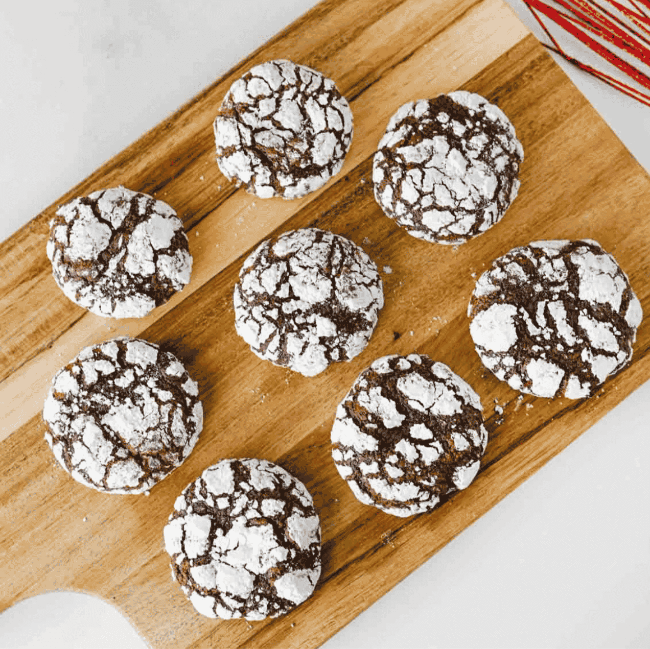 These Chocolate Crinkle Cookies are rich, fudgy, and rolled in powdered sugar for that classic crackled holiday cookie look. Made with cocoa powder, granulated sugar, oil, eggs, vanilla, flour, baking powder, salt, and powdered sugar, this easy chocolate cookie recipe chills overnight so the dough bakes up soft, chewy, and deeply chocolatey. Perfect for Christmas cookie trays, holiday baking, cookie exchanges, dessert platters, bake sales, homemade food gifts, or cozy weekend treats, these homemade chocolate crinkles are simple to make and always look bakery-worthy. Save this recipe for easy Christmas cookies, fudgy chocolate cookies, powdered sugar cookies, make ahead cookie dough, chocolate Christmas cookies, and holiday desserts everyone will grab first.