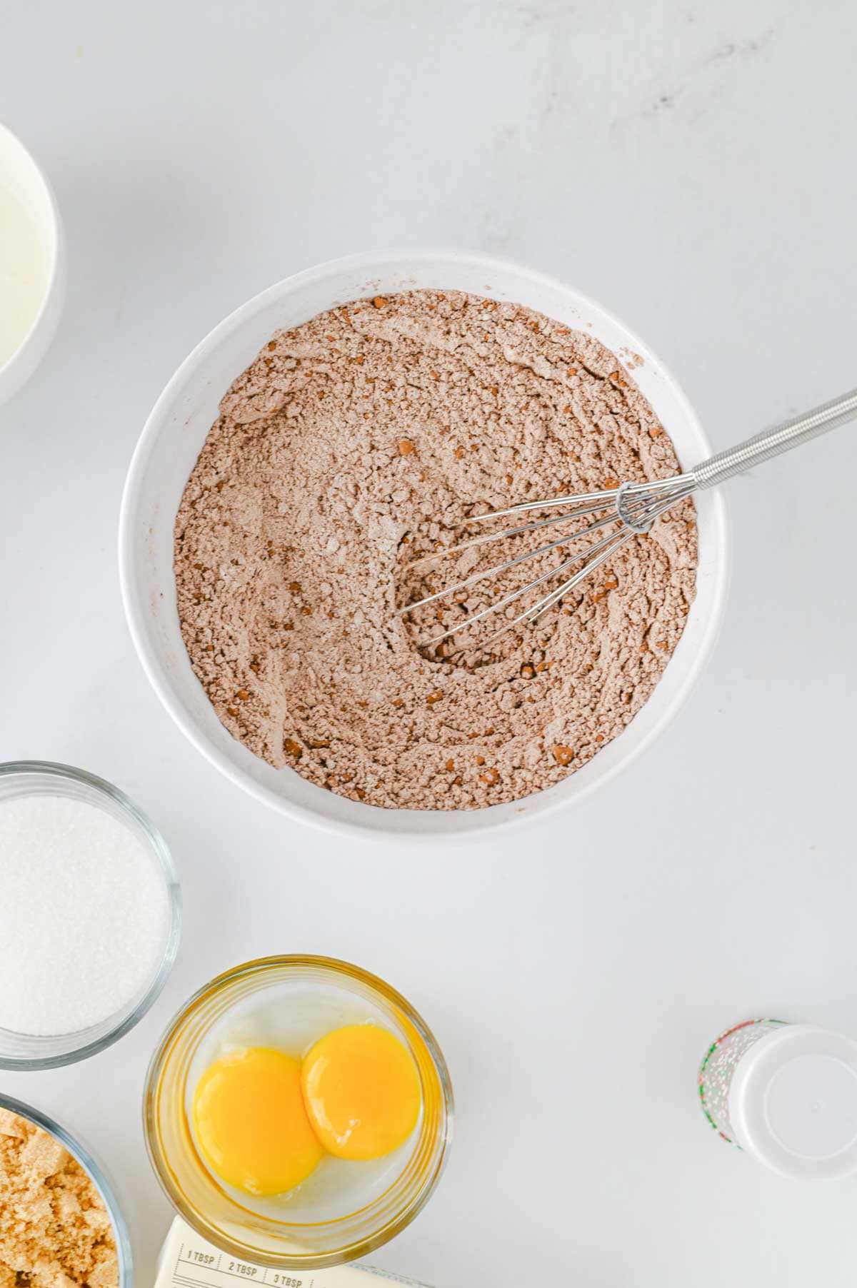 dry ingredients for cookies whisked together in a mixing bowl