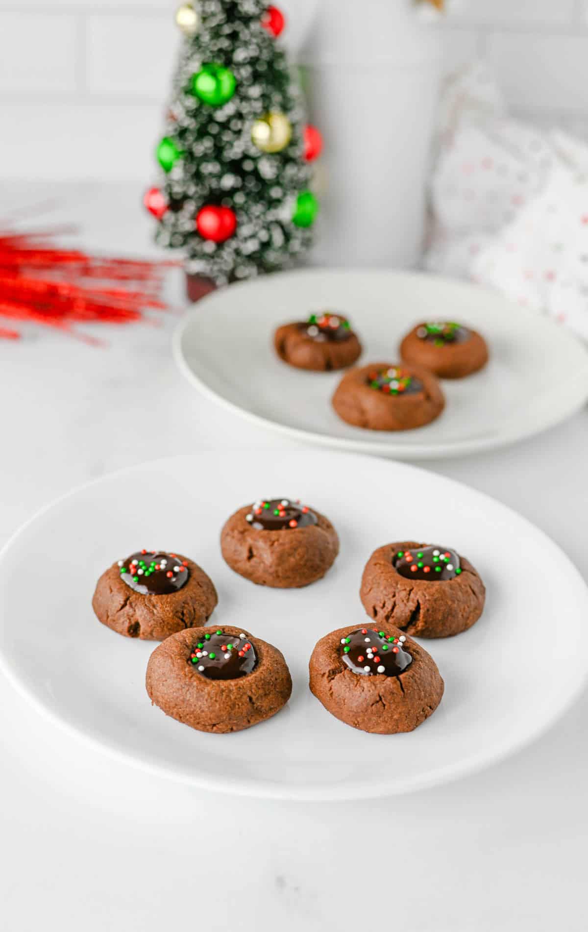 christmas thumbprint cookies on plates