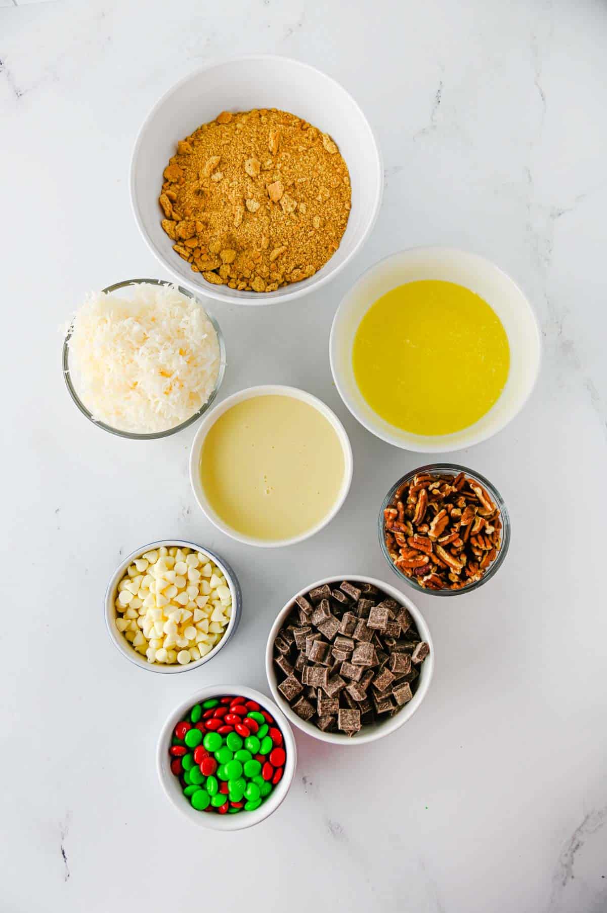 christmas 7 layer bars ingredients on the kitchen counter