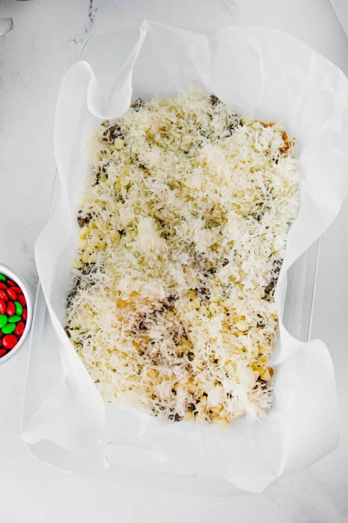 shreeded coconut on top of magic cookie bars