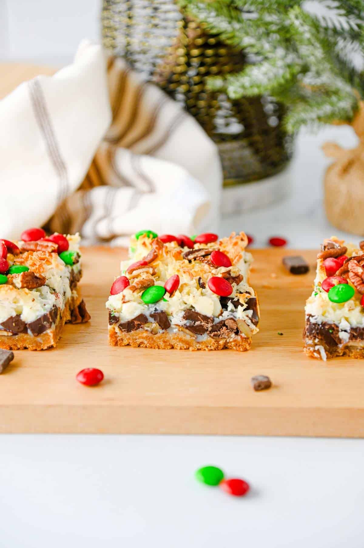 christmas dessert bars on a wooden serving board