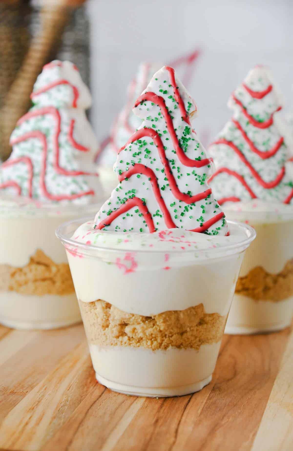 vanilla pudding cup topped with christmas tree cake