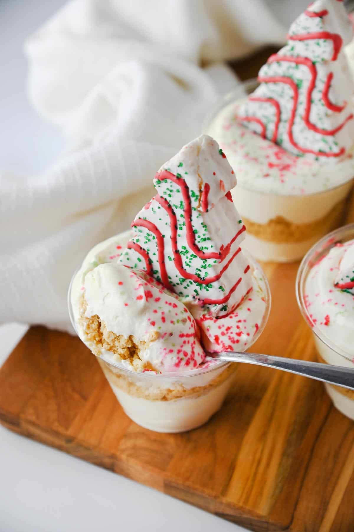 scooping a bite from a christmas tree cake dirt cup