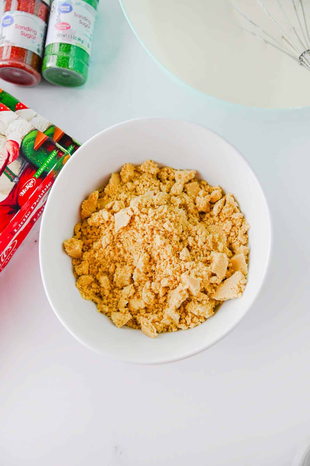 crumbled golden oreos in a mixing bowl