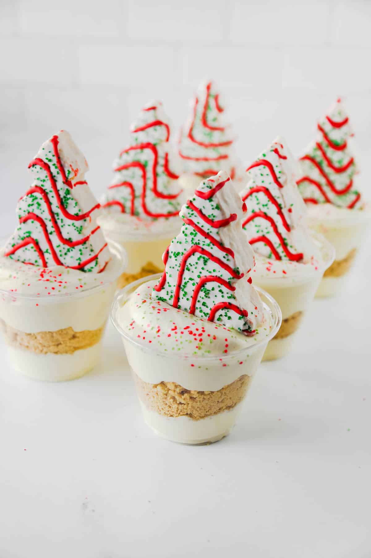 christmas tree cake pudding cups on the counter