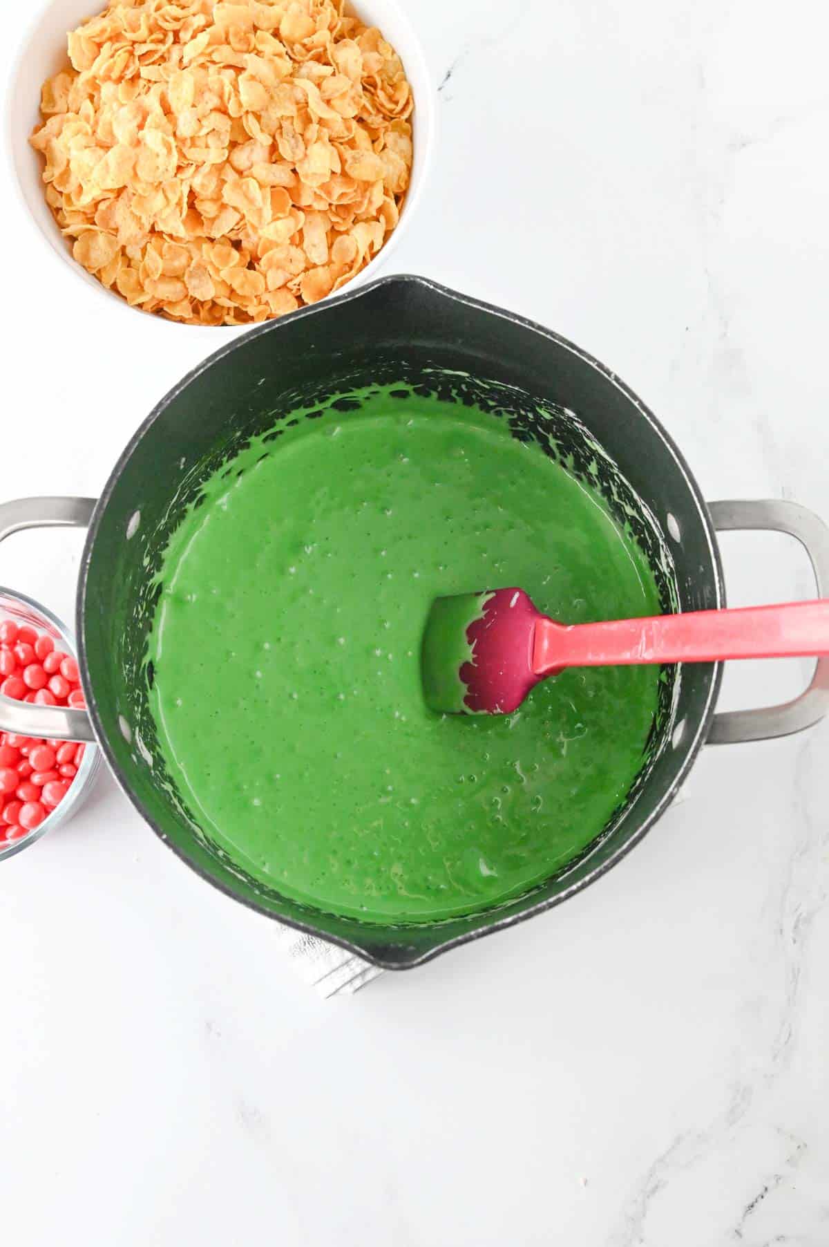 green melted marshmallow mixture in a pot