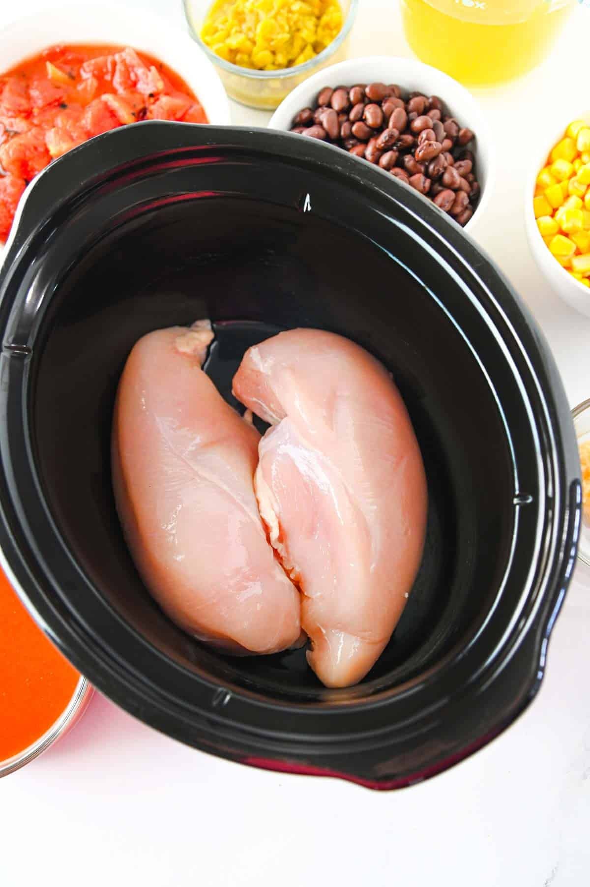 raw chicken breasts in a crock pot